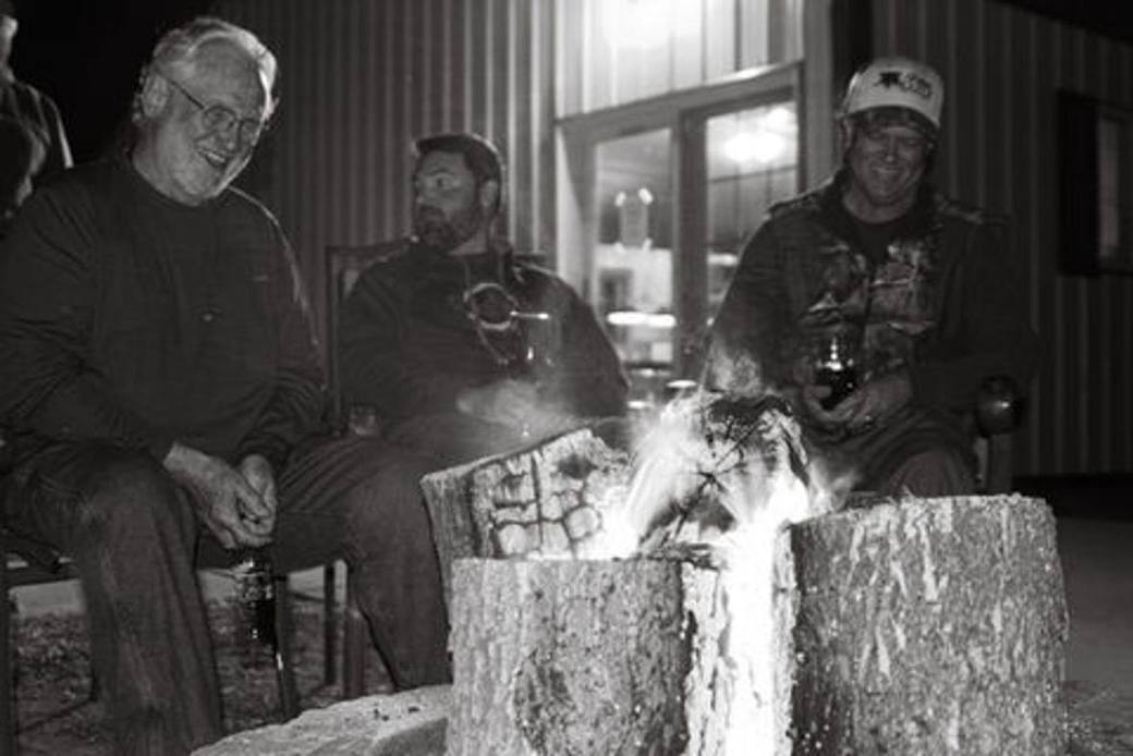 Guests around the fire pit at the lodge