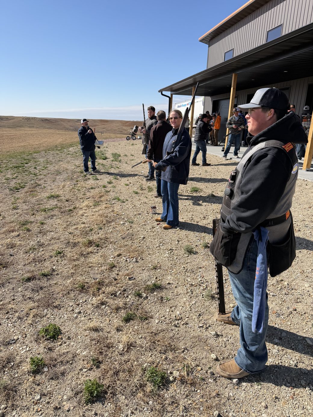 Guests gathered outside at The Range between rounds