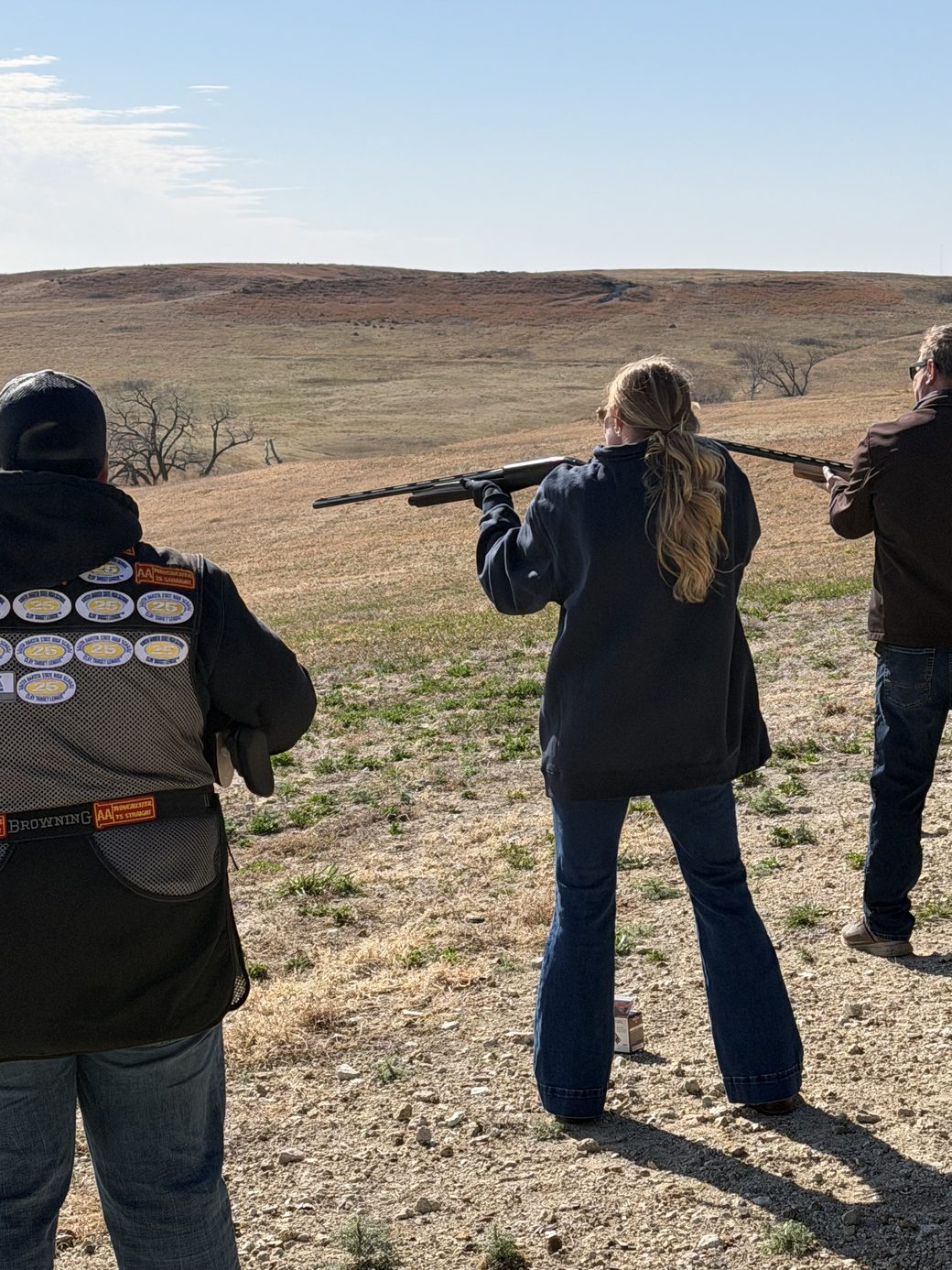 Shooting clays at The Range with the South Dakota hills behind
